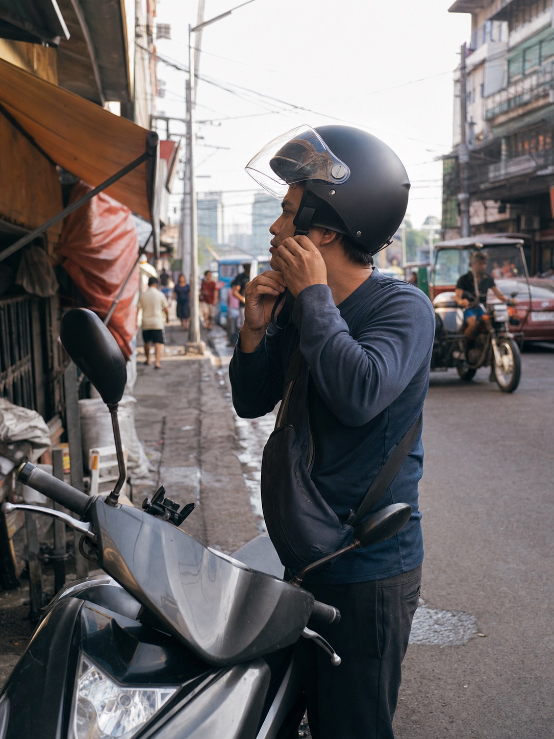 Illustrative scene of a delivery rider fastening a protective helmet beside a scooter
